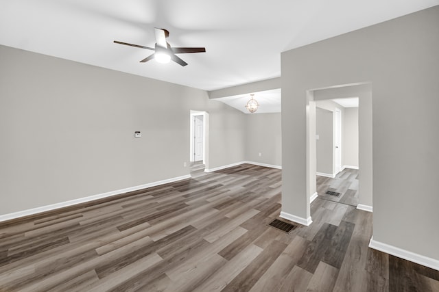 empty room featuring hardwood / wood-style floors and ceiling fan