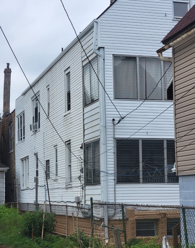 rear view of house with cooling unit