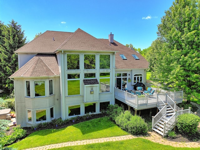 exterior space with a lawn and a wooden deck