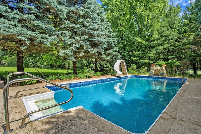 view of pool featuring a water slide