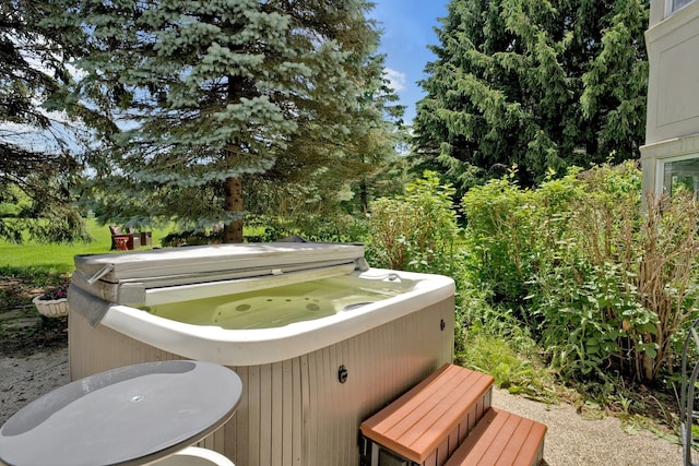 exterior space with a hot tub