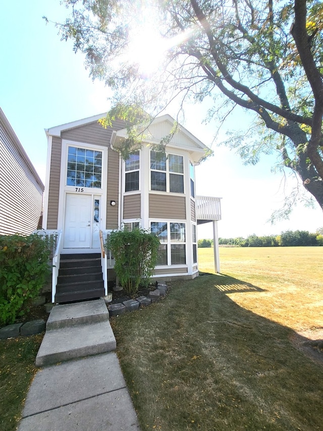 view of front of home with a front yard