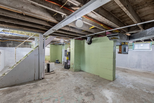 basement with water heater and electric panel