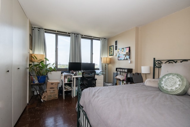 bedroom with dark parquet floors