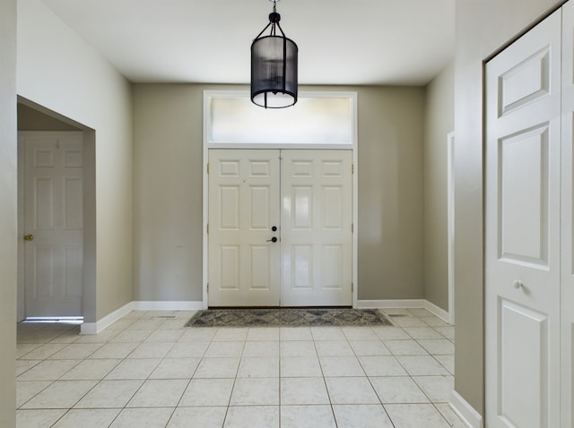 foyer with light tile patterned flooring