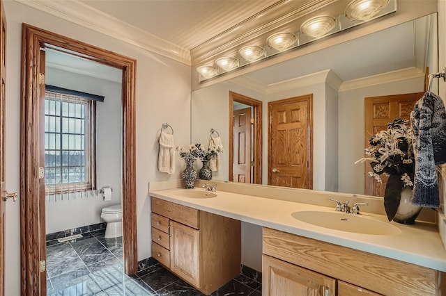 bathroom featuring ornamental molding, vanity, and toilet