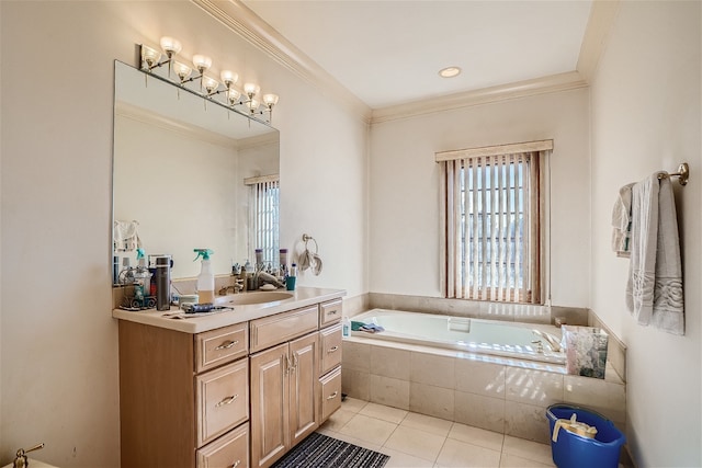 bathroom featuring tiled tub, vanity, ornamental molding, and tile patterned floors