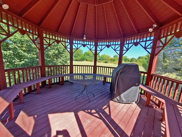 wooden deck with a grill and a gazebo