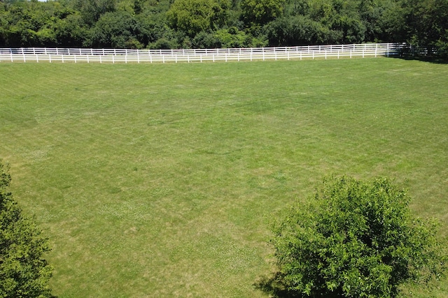 view of yard with a rural view