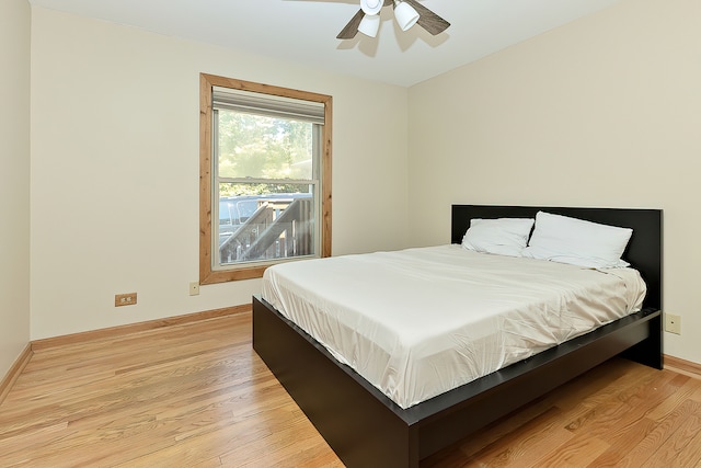 bedroom featuring ceiling fan and light hardwood / wood-style flooring