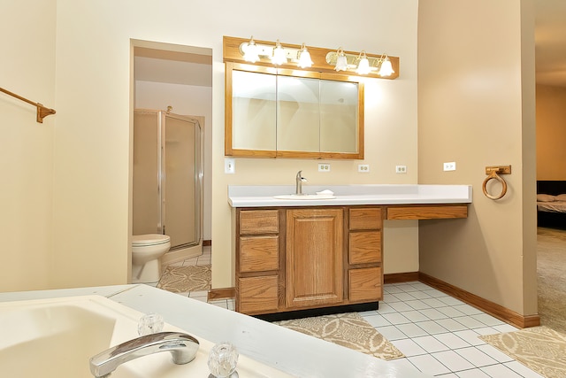 bathroom featuring vanity, tile patterned flooring, toilet, and an enclosed shower