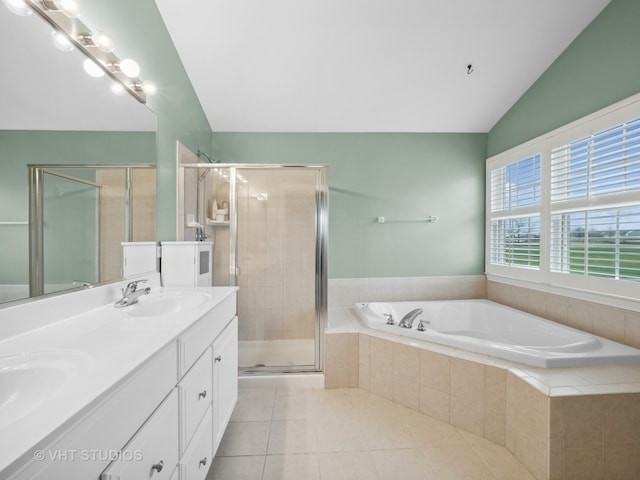 bathroom with vanity, tile patterned flooring, plus walk in shower, and lofted ceiling