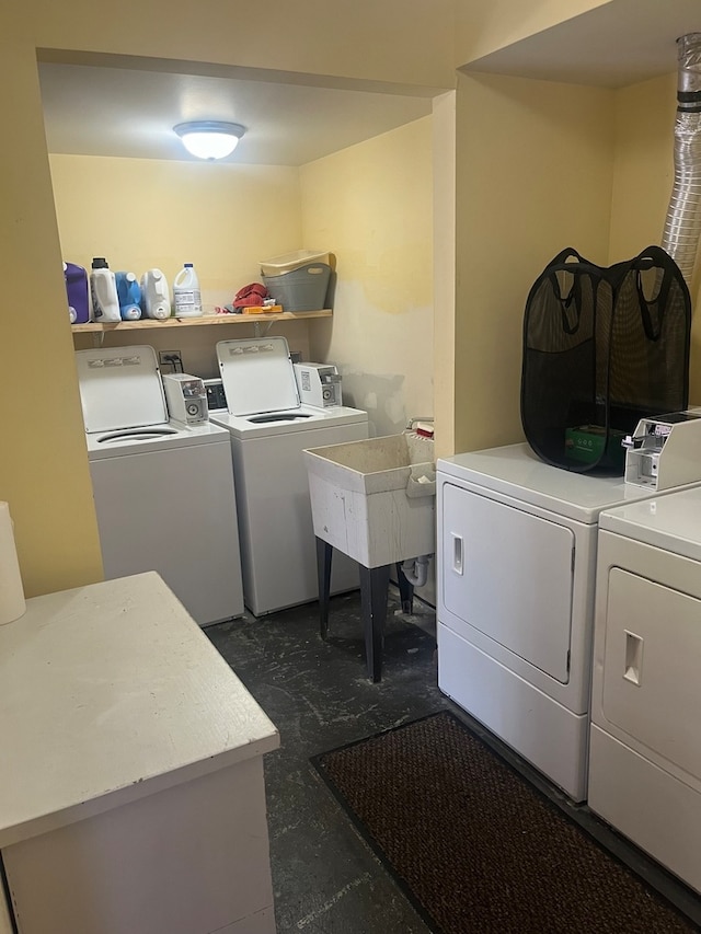 clothes washing area featuring washer and clothes dryer