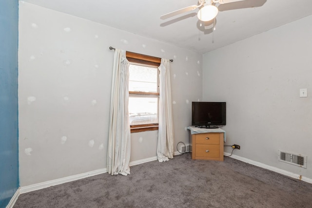 interior space featuring ceiling fan and carpet