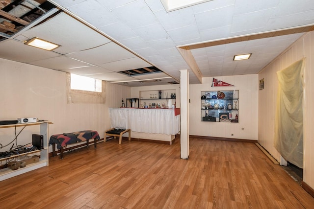 basement with hardwood / wood-style flooring