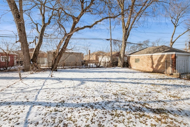 view of yard layered in snow