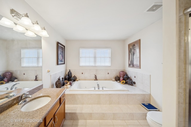 bathroom featuring tile patterned flooring, plenty of natural light, and vanity