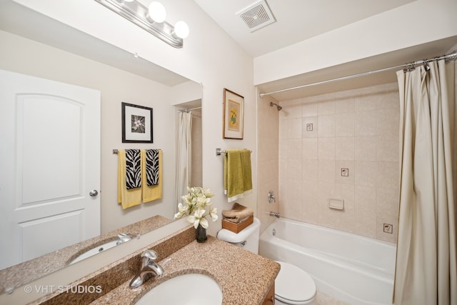 full bathroom with vanity, toilet, and shower / tub combo with curtain