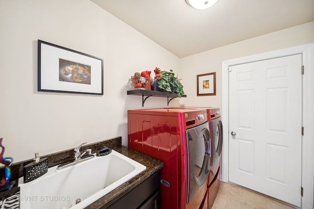 laundry area featuring independent washer and dryer, sink, and light tile patterned flooring