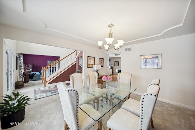 dining area featuring a chandelier