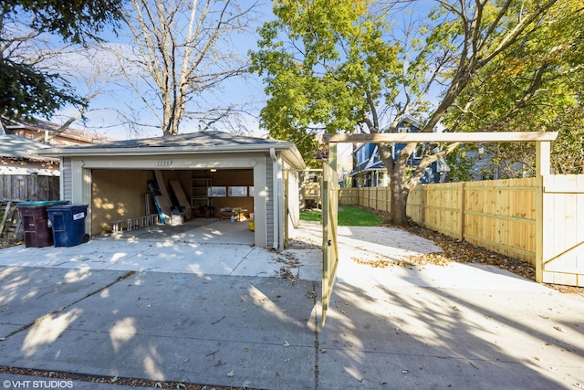 view of patio / terrace with an outdoor structure and a garage