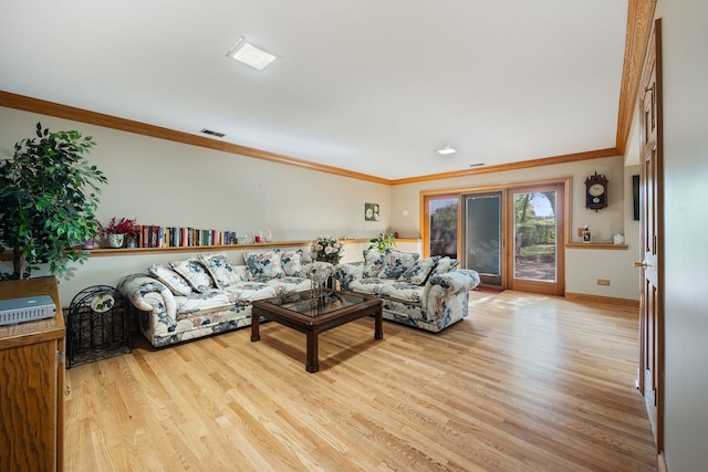 living room featuring crown molding and light wood-type flooring