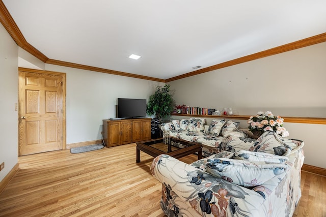 living room with light hardwood / wood-style flooring and ornamental molding