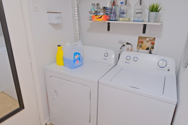 washroom featuring washer and dryer