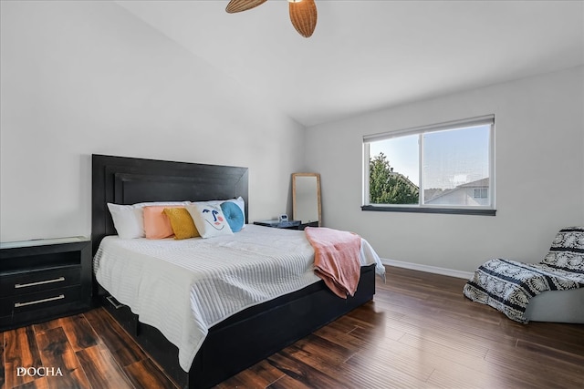 bedroom featuring lofted ceiling, dark hardwood / wood-style flooring, and ceiling fan