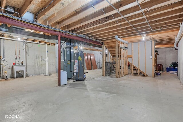 basement with gas water heater and heating unit