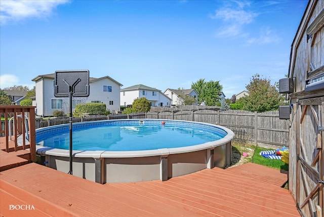 view of swimming pool featuring a wooden deck