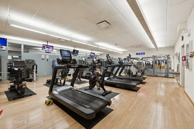 gym with hardwood / wood-style flooring