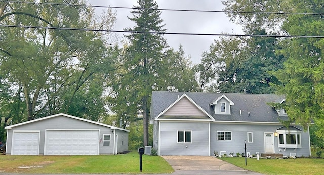 view of front of house with a garage and a front yard