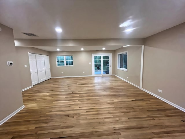 empty room with hardwood / wood-style floors