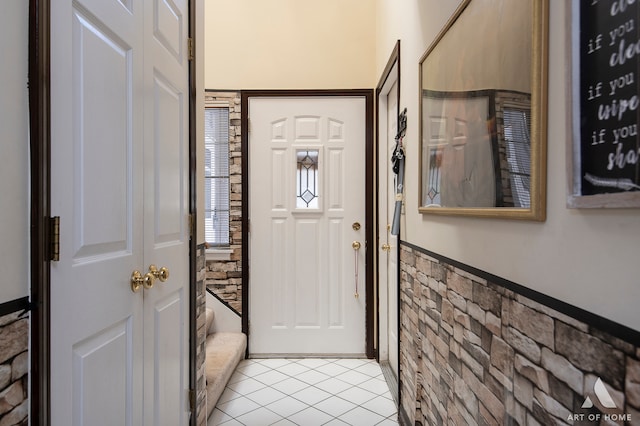 entryway with light tile patterned floors