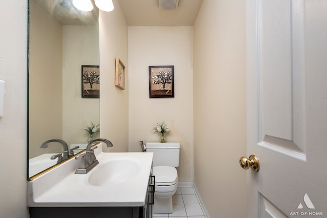 bathroom featuring tile patterned floors, vanity, and toilet