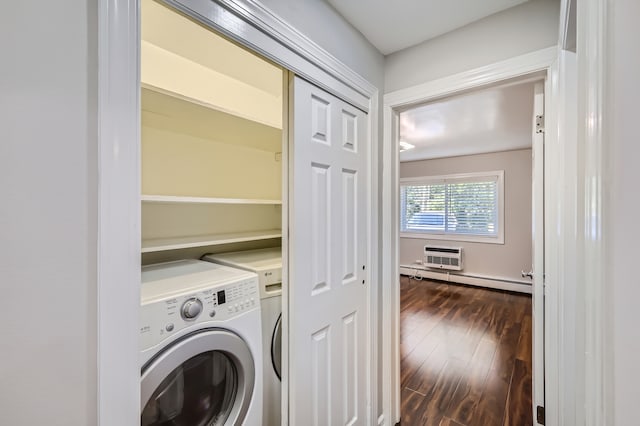 laundry room with a baseboard heating unit, a wall mounted AC, dark wood-type flooring, and washer / dryer