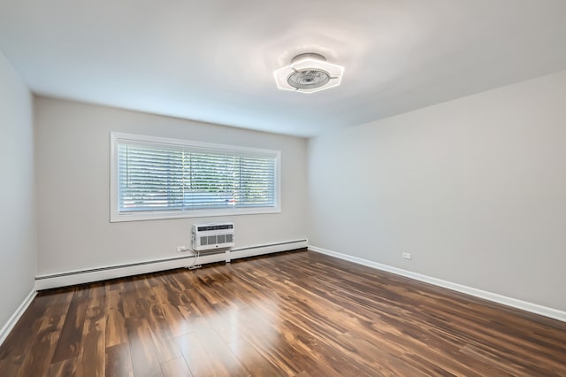 unfurnished room featuring baseboard heating, dark hardwood / wood-style flooring, and an AC wall unit