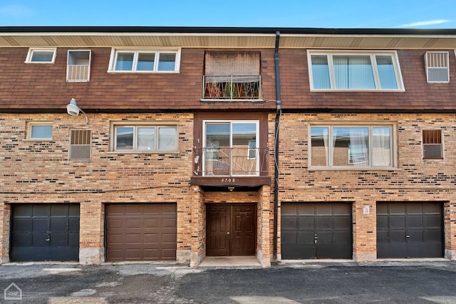 view of front of house with a balcony and a garage