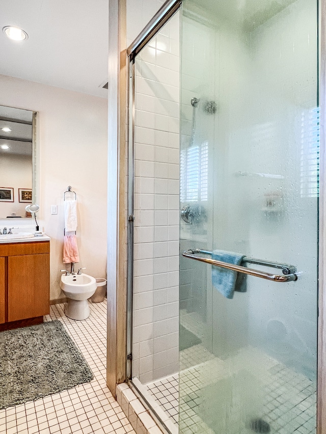 bathroom featuring vanity, tile patterned flooring, a bidet, and a shower with shower door