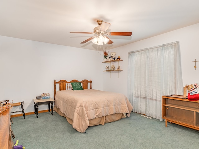 carpeted bedroom with ceiling fan