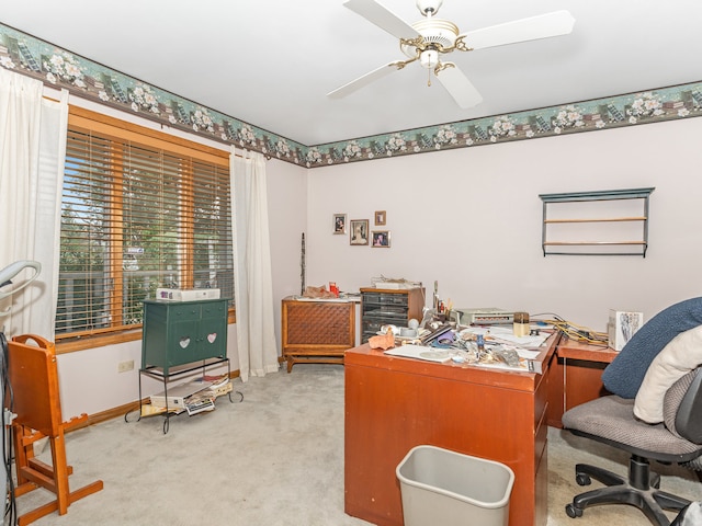 office featuring light carpet and ceiling fan