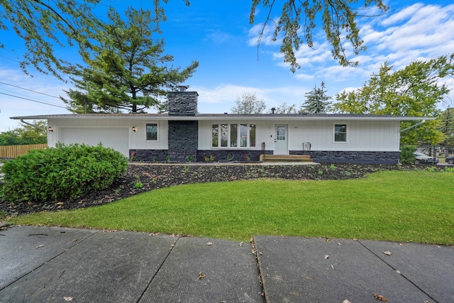 ranch-style house with a front yard and a garage