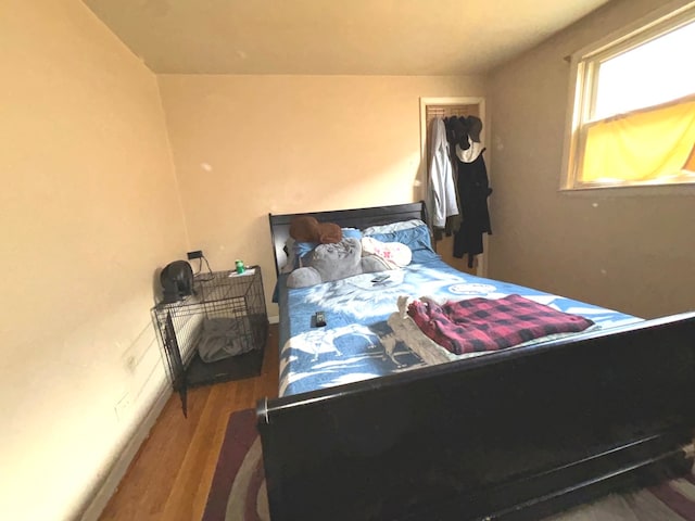 bedroom with wood-type flooring