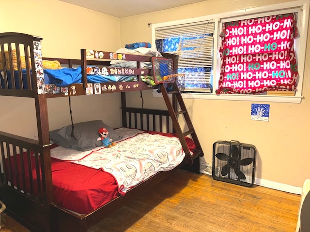 bedroom with hardwood / wood-style flooring