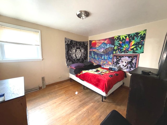 bedroom featuring wood-type flooring