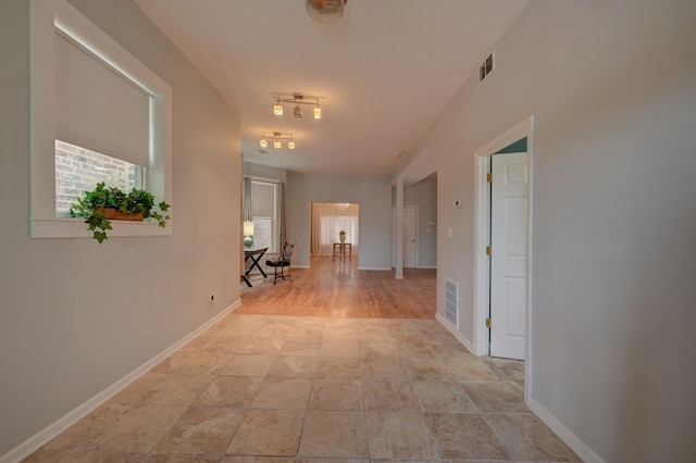 hall with light wood-type flooring