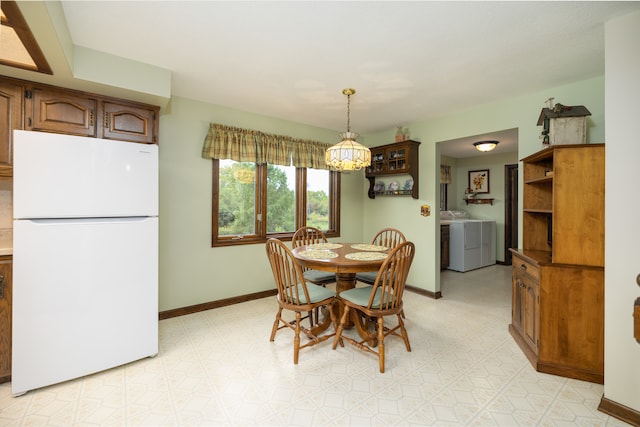 dining space featuring washing machine and clothes dryer