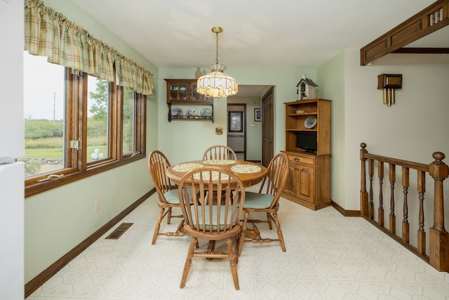 dining room with a notable chandelier