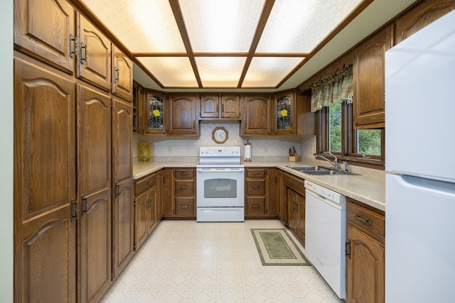 kitchen with sink and white appliances